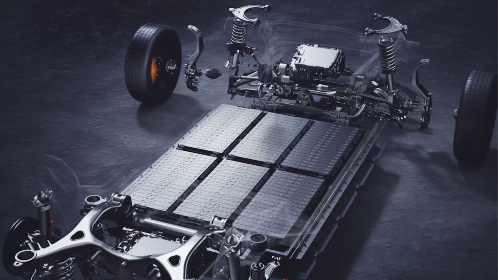 A highly detailed, semi-transparent rendering of an electric vehicle's chassis, highlighting the integrated solid-state battery pack with silicon-carbon anodes, surrounded by suspension components and large wheels on a dark surface.