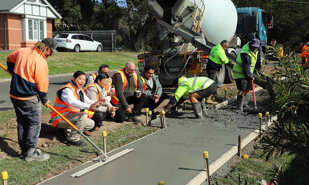 Footpath with coffee concrete being poured. 