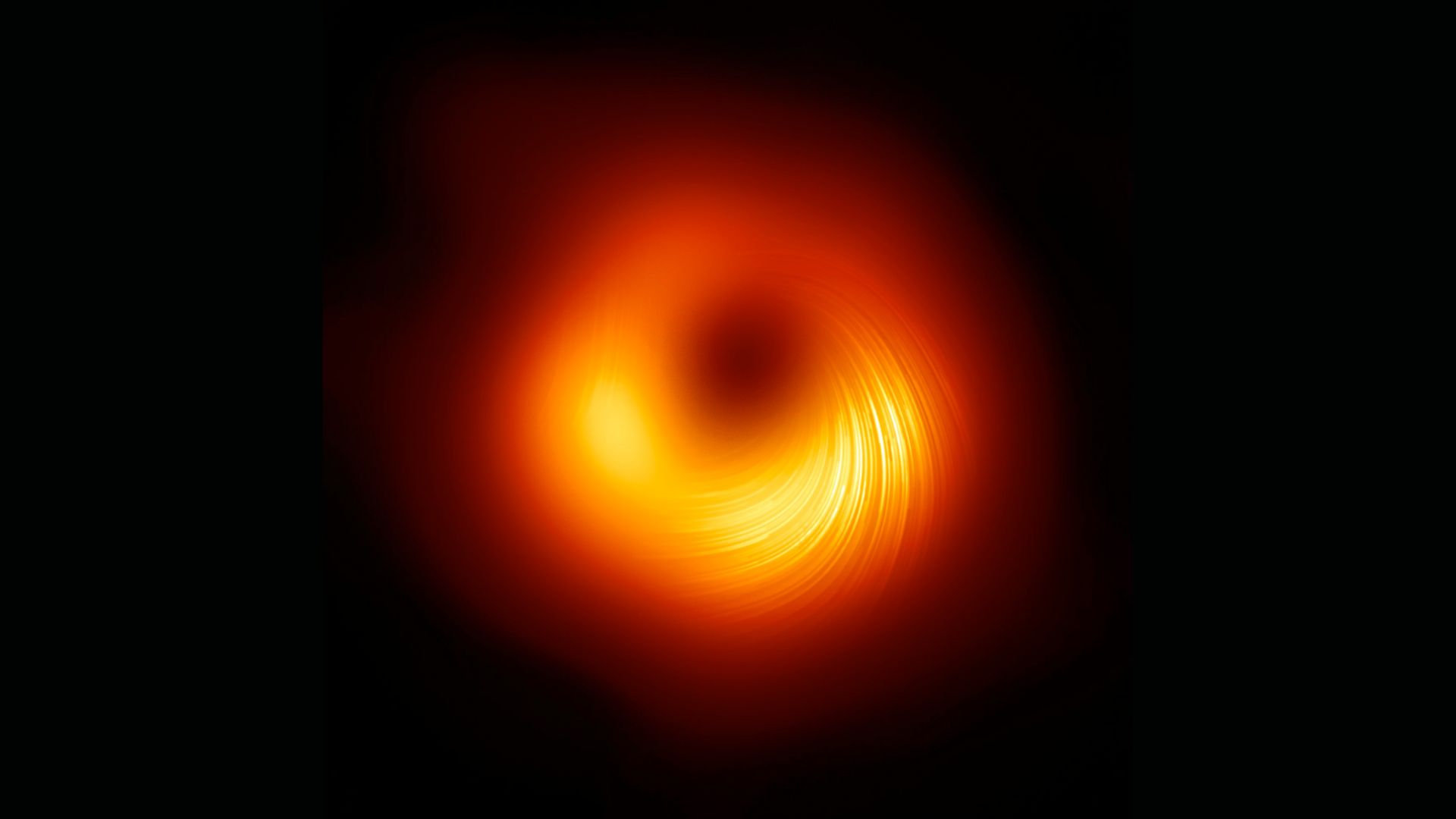 Vue du trou noir supermassif M87 en lumière polarisée.
