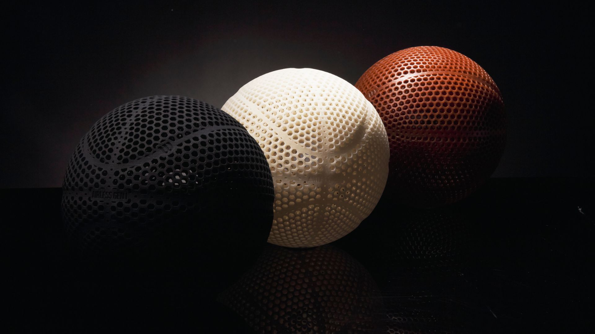 Wilson's Airless Gen1 Basketball showcased in three colours, black, white, and brown. 