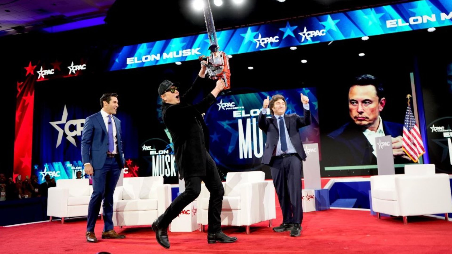 Elon Musk waves ‘chainsaw for democracy,’ touting cuts to US spending