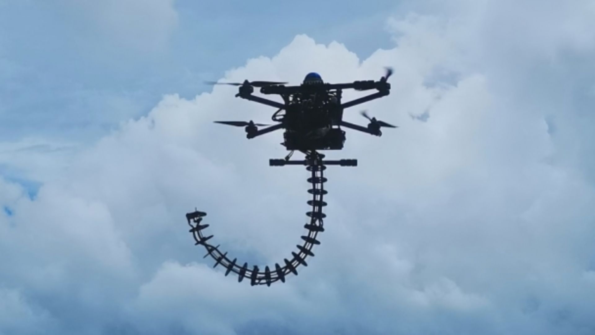 Elephant trunk drone arm bends, grabs, and works in tight spaces