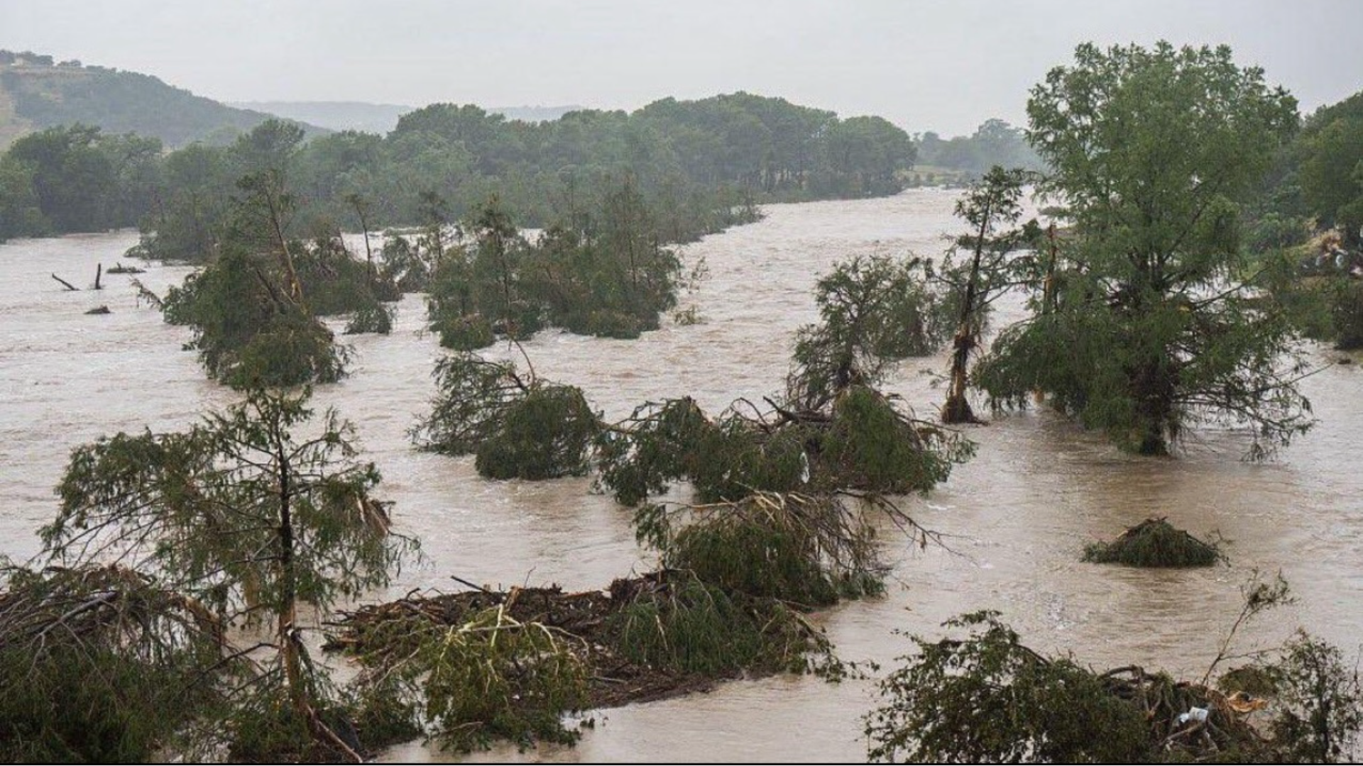 Flash floods devastate central Texas, killing 27 and sweeping away homes